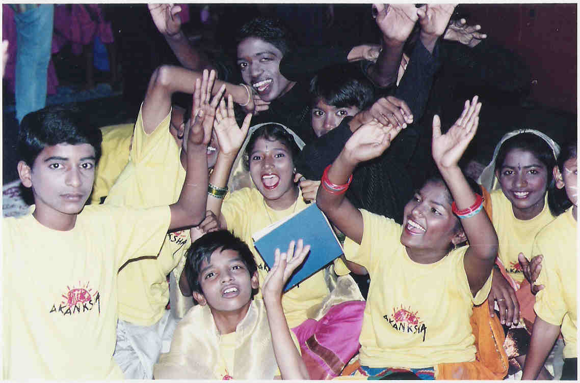 Operation Khazana — children in animal costumes perform on a lit stage